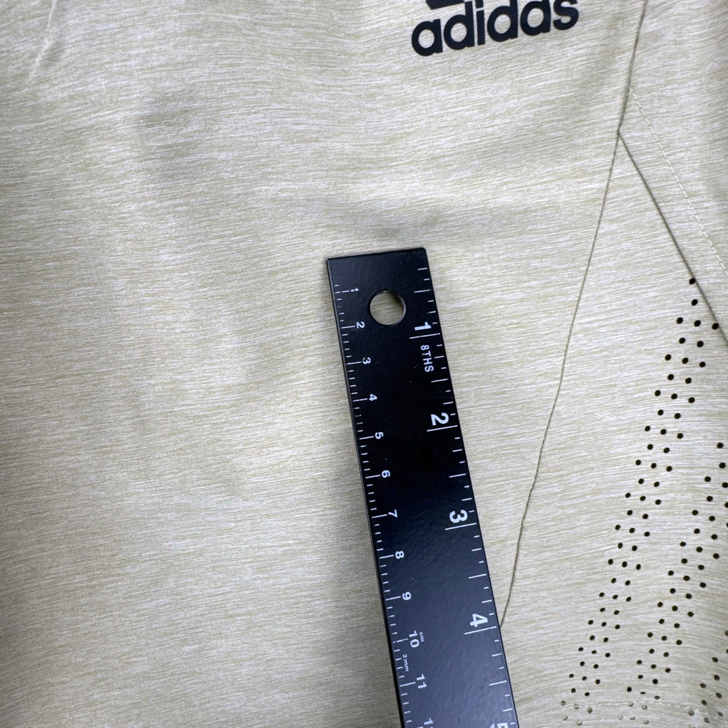 Adidas men's heather beige athletic training shorts in size medium with black elastic waistband and side vents