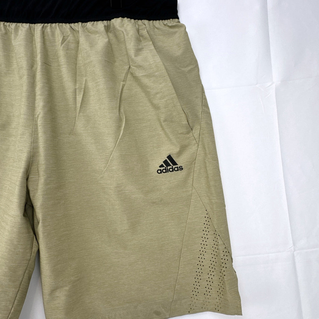 Adidas men's heather beige athletic training shorts in size medium with black elastic waistband and side vents