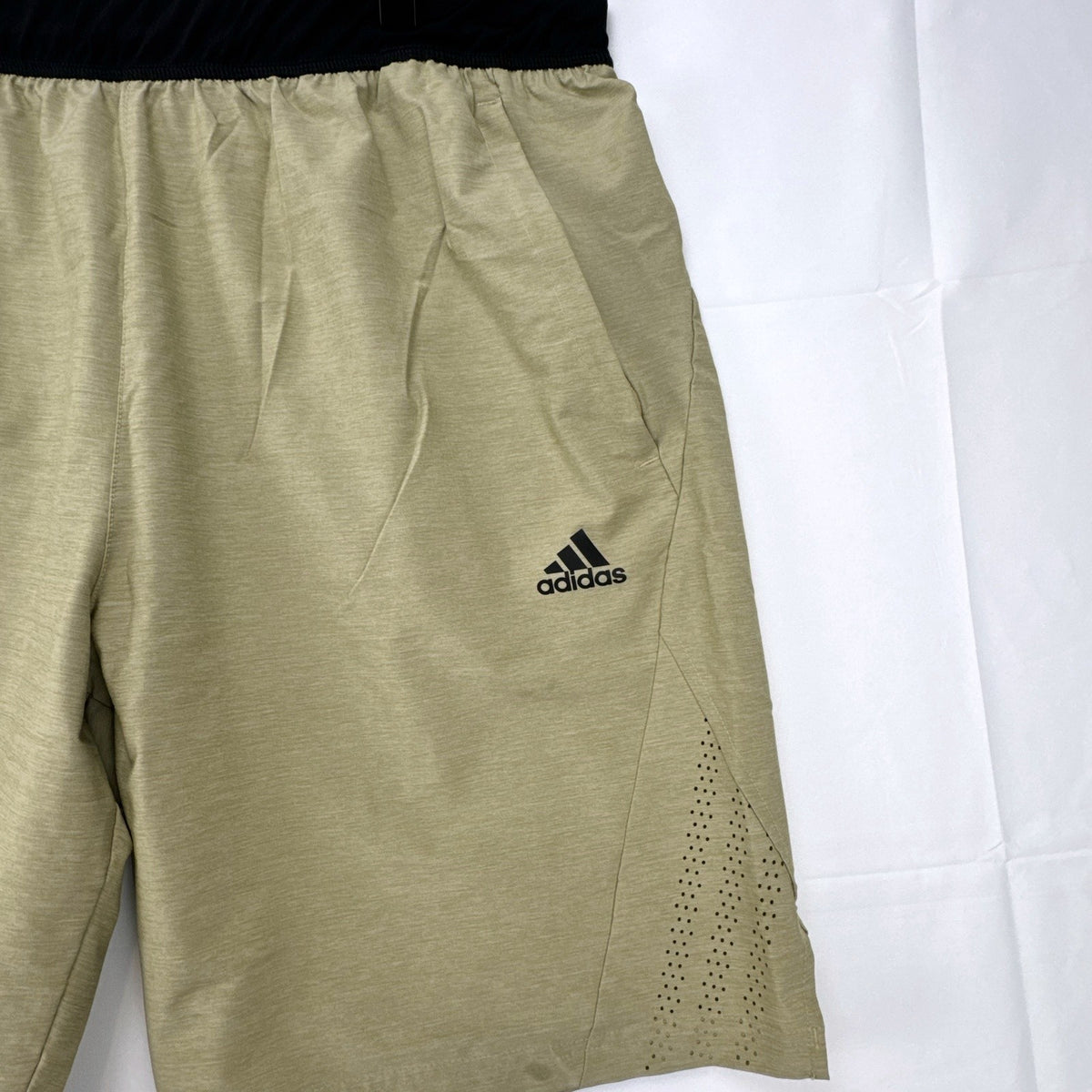 Adidas men's heather beige athletic training shorts in size medium with black elastic waistband and side vents