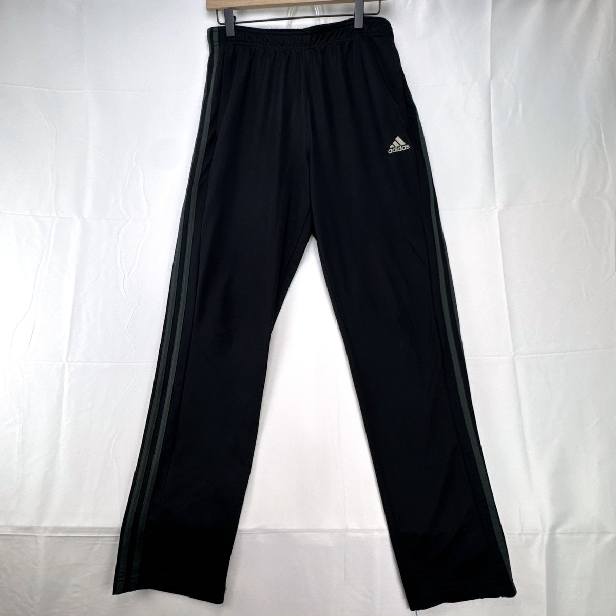 Men's black adidas straight leg track pants with gray 3-stripes in size medium