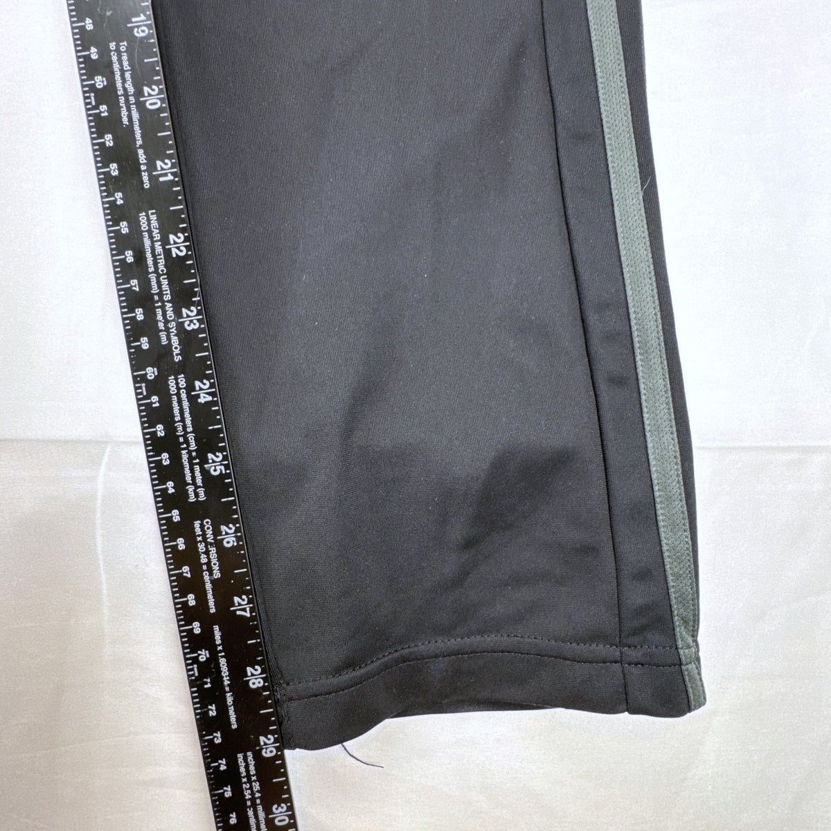 Men's black adidas straight leg track pants with gray 3-stripes in size medium