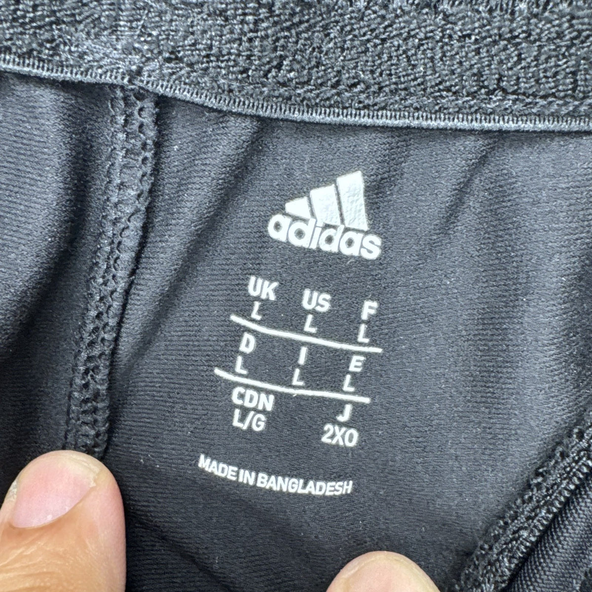 Men's black adidas straight leg track pants with gray 3-stripes in size medium