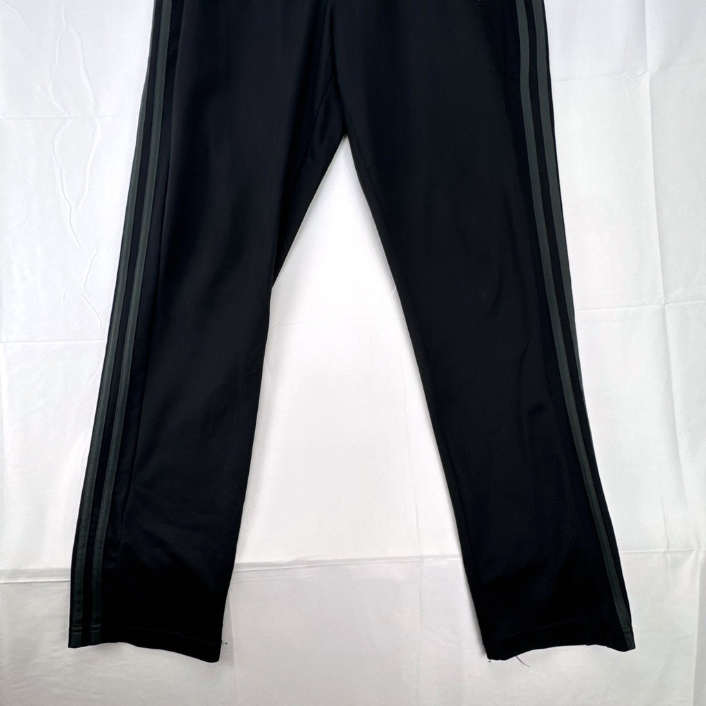Men's black adidas straight leg track pants with gray 3-stripes in size medium