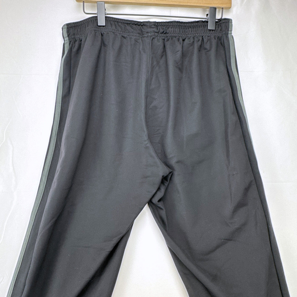 Men's black adidas straight leg track pants with gray 3-stripes in size medium
