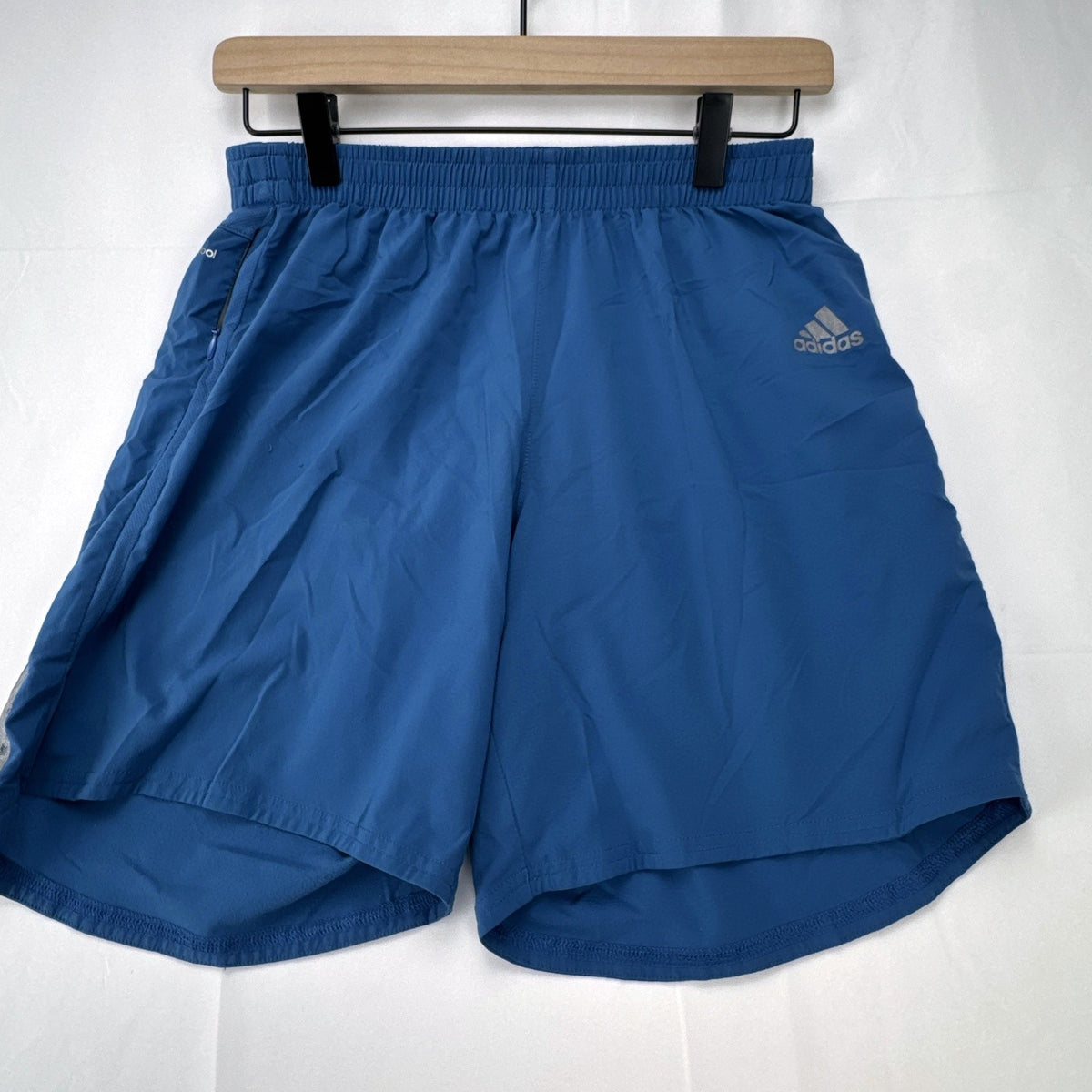 Men's blue adidas Climacool running shorts in size small with zippered pocket and reflective detailing.