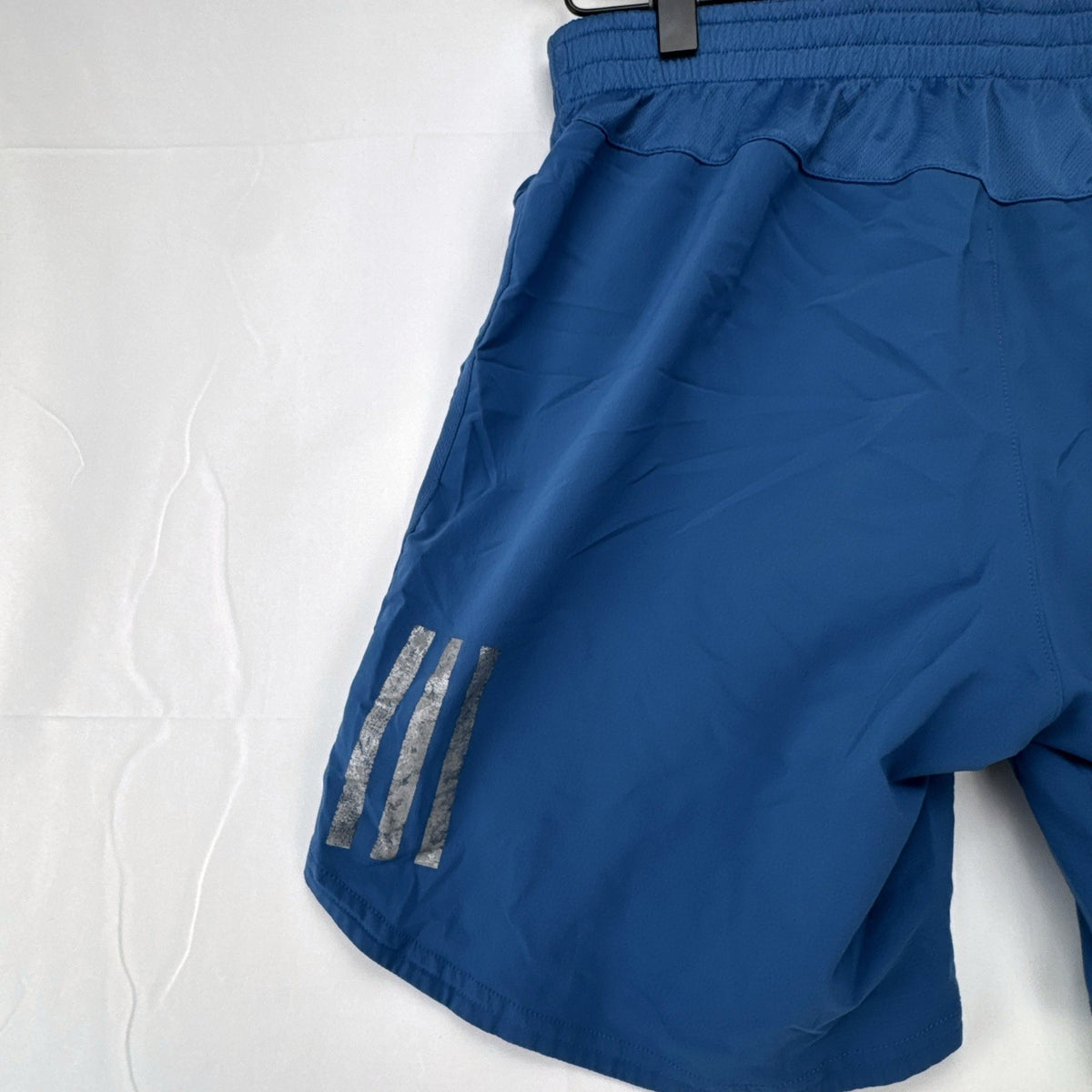 Men's blue adidas Climacool running shorts in size small with zippered pocket and reflective detailing.