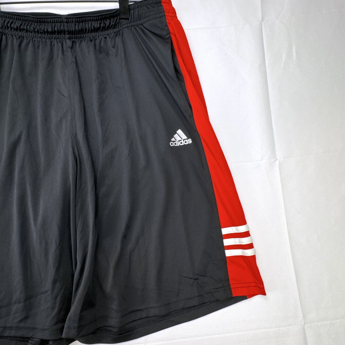 adidas men's size large basketball shorts in charcoal gray and red with Climalite fabric