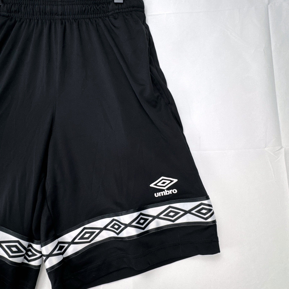 Umbro men's black athletic soccer shorts with diamond logo tape in size Small