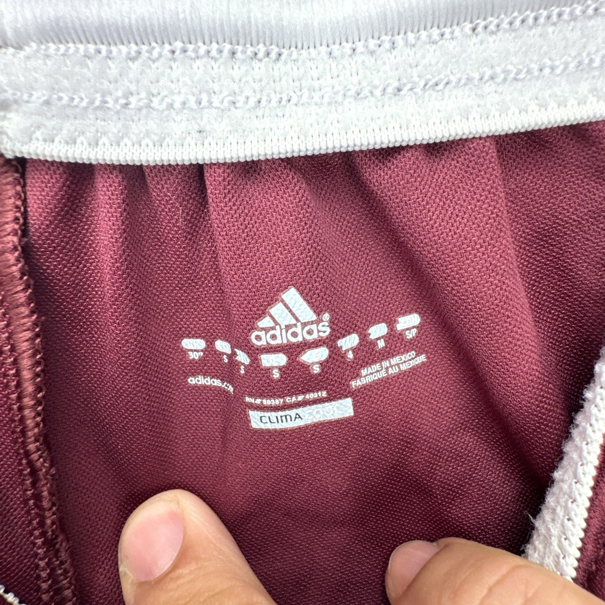 adidas Climacool maroon athletic soccer shorts in men's regular size small with white stripes