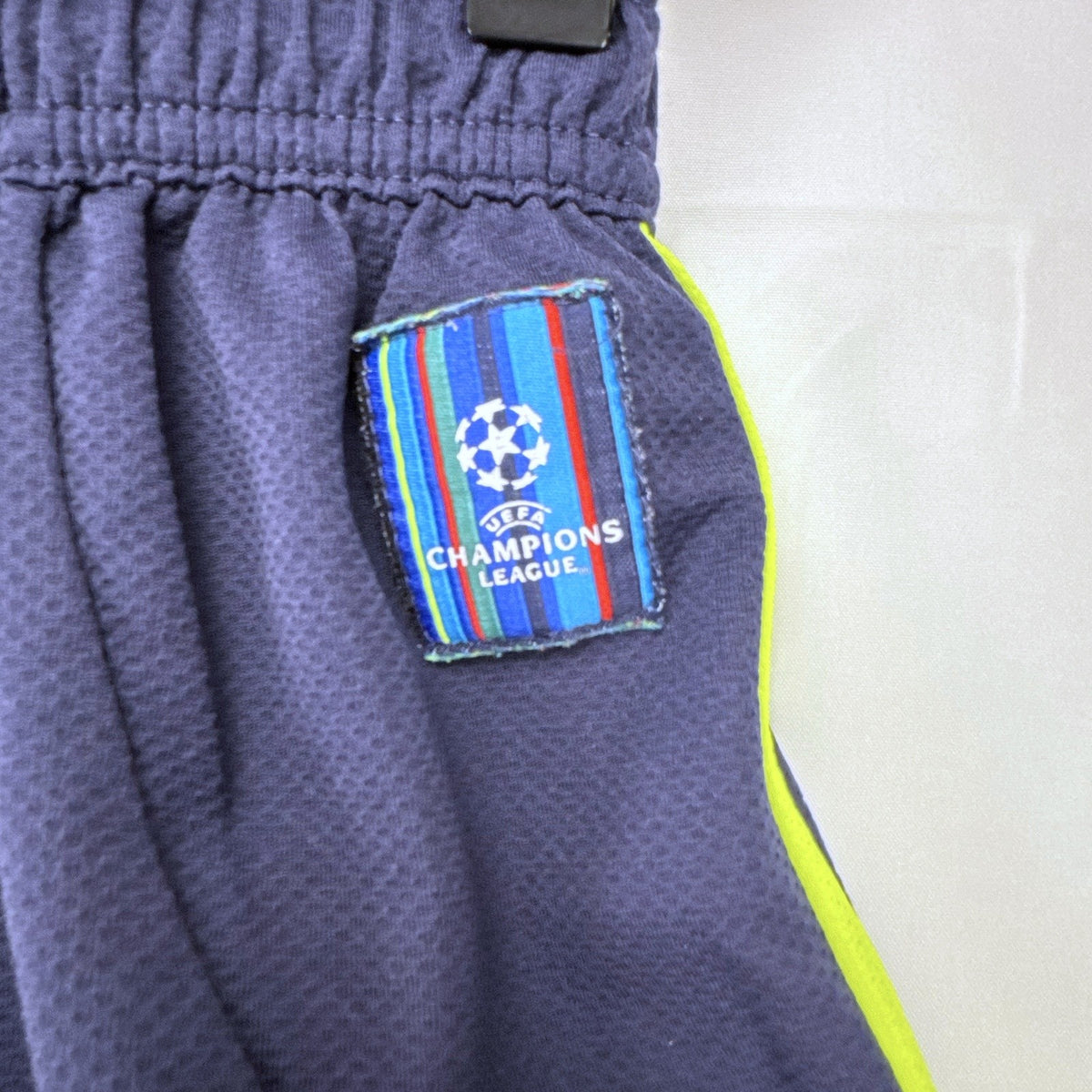 adidas UEFA Champions League soccer shorts in navy blue with neon yellow accents, men's small