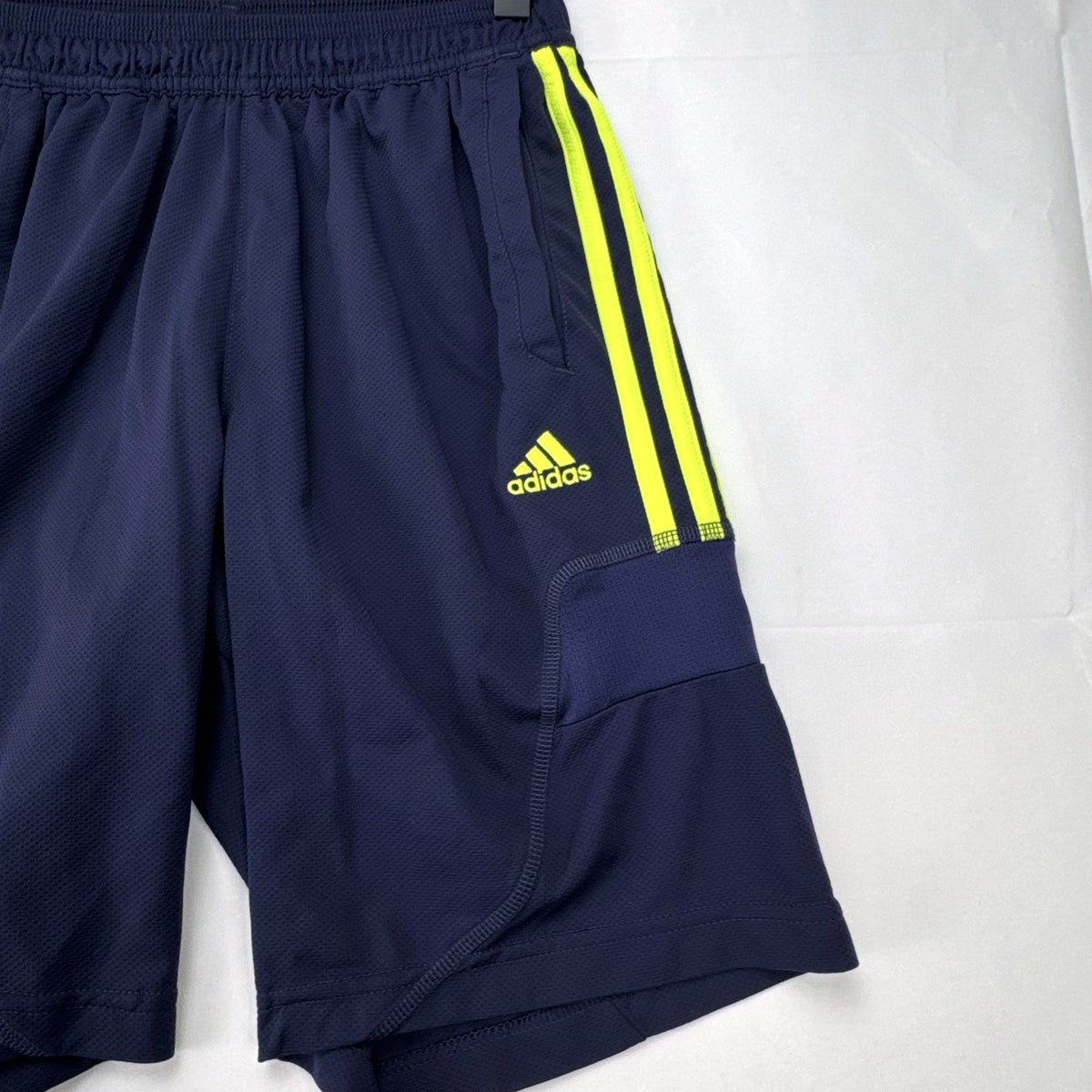 adidas UEFA Champions League soccer shorts in navy blue with neon yellow accents, men's small