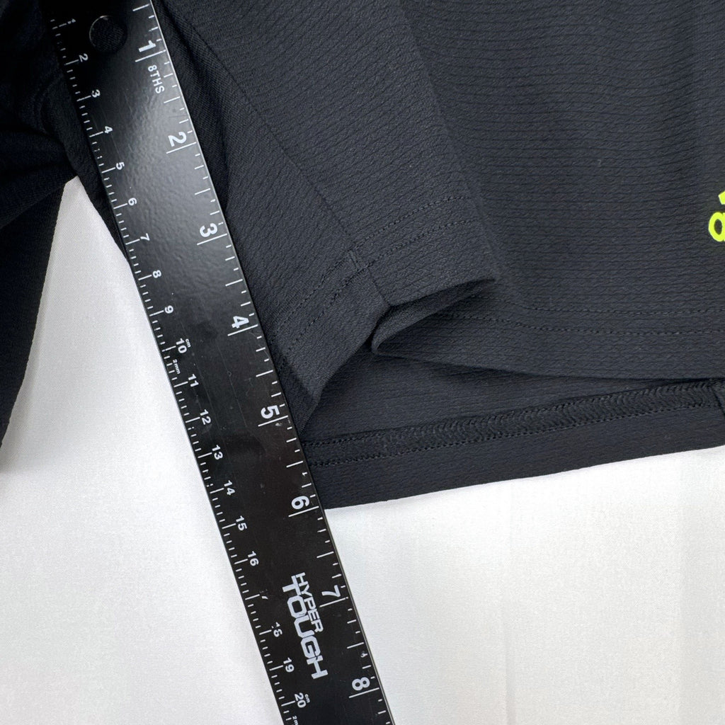 Women's black and neon green adidas soccer shorts featuring 3-Stripes sides in size Large.