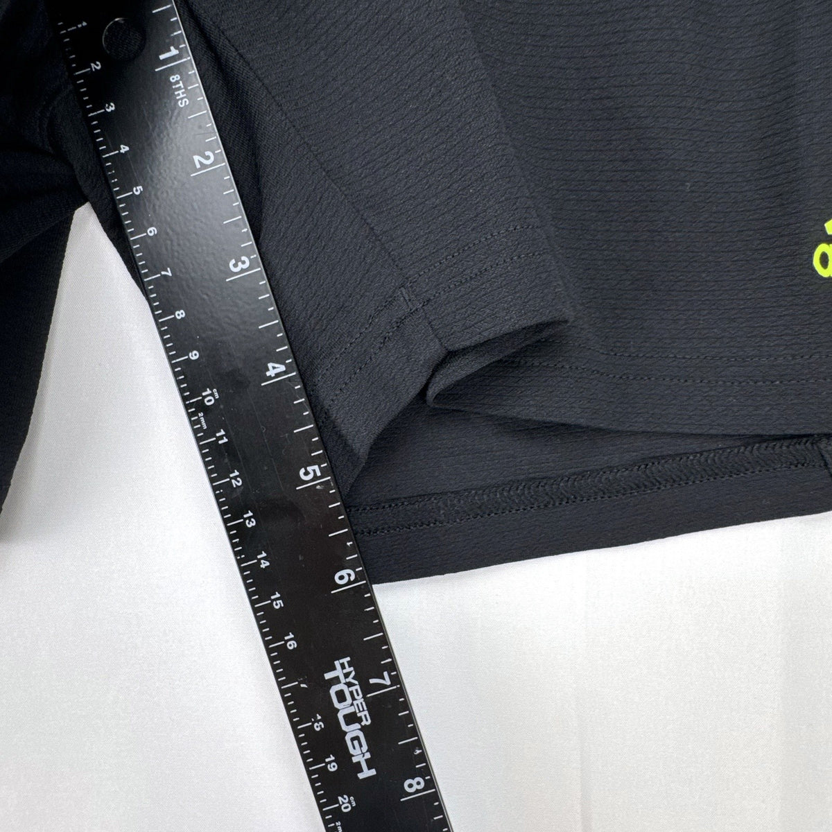 Women's black and neon green adidas soccer shorts featuring 3-Stripes sides in size Large.