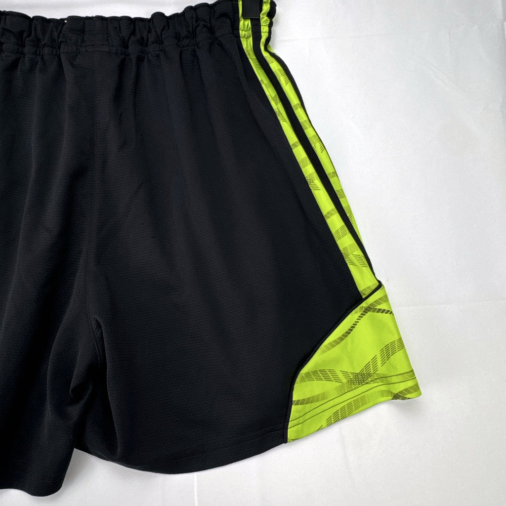 Women's black and neon green adidas soccer shorts featuring 3-Stripes sides in size Large.