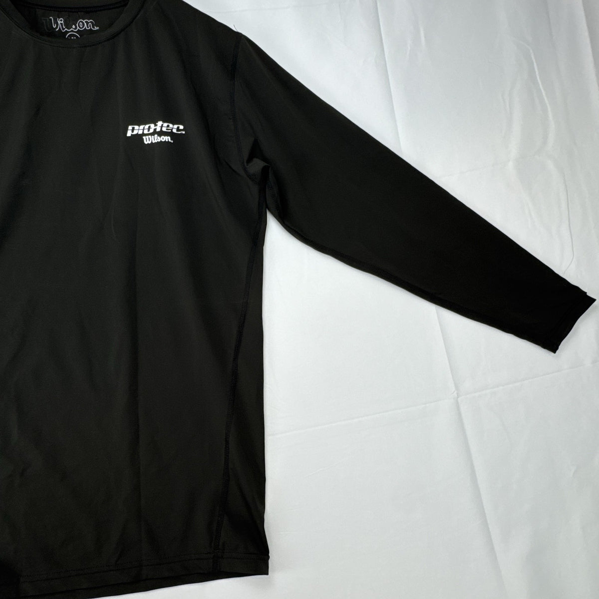 Wilson Protec men's long sleeve compression shirt in charcoal gray, size XL.