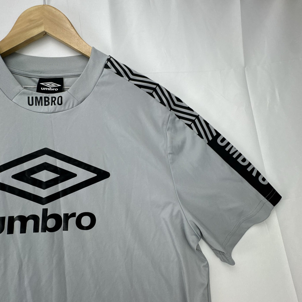 Umbro men's gray short sleeve soccer training jersey in size M featuring logo tape detailing