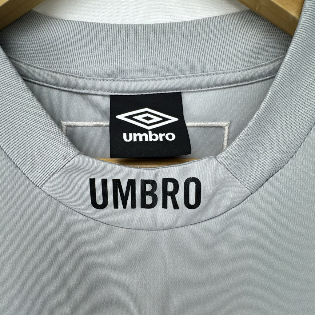 Umbro men's gray short sleeve soccer training jersey in size M featuring logo tape detailing