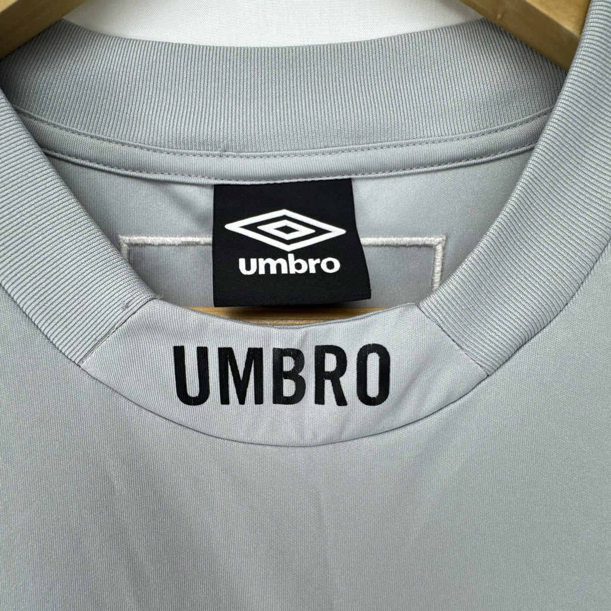 Umbro men's gray short sleeve soccer training jersey in size M featuring logo tape detailing