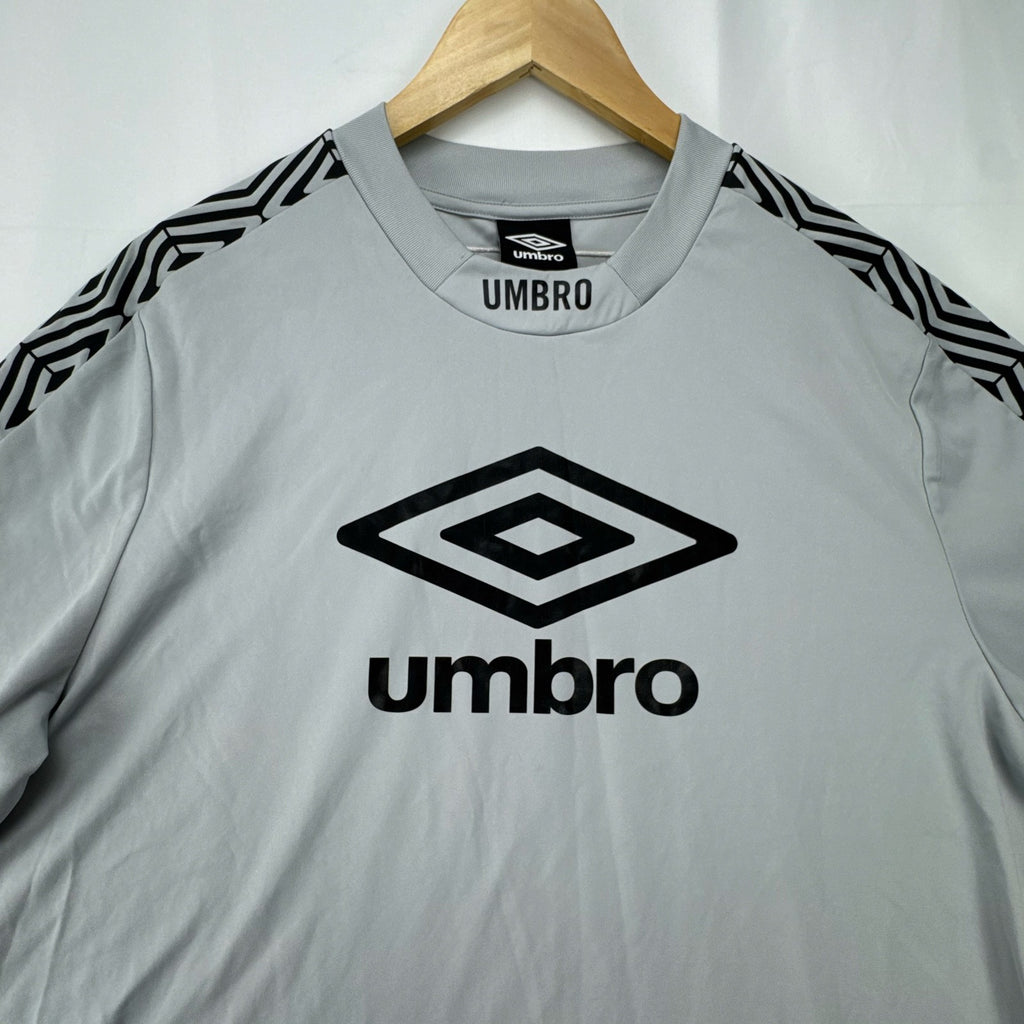 Umbro men's gray short sleeve soccer training jersey in size M featuring logo tape detailing