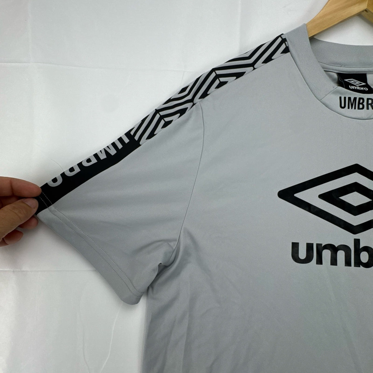 Umbro men's gray short sleeve soccer training jersey in size M featuring logo tape detailing