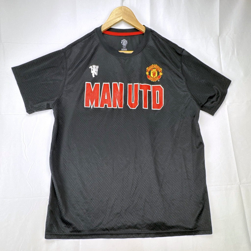 Front view of official Manchester United black short sleeve training jersey in men's size XL.