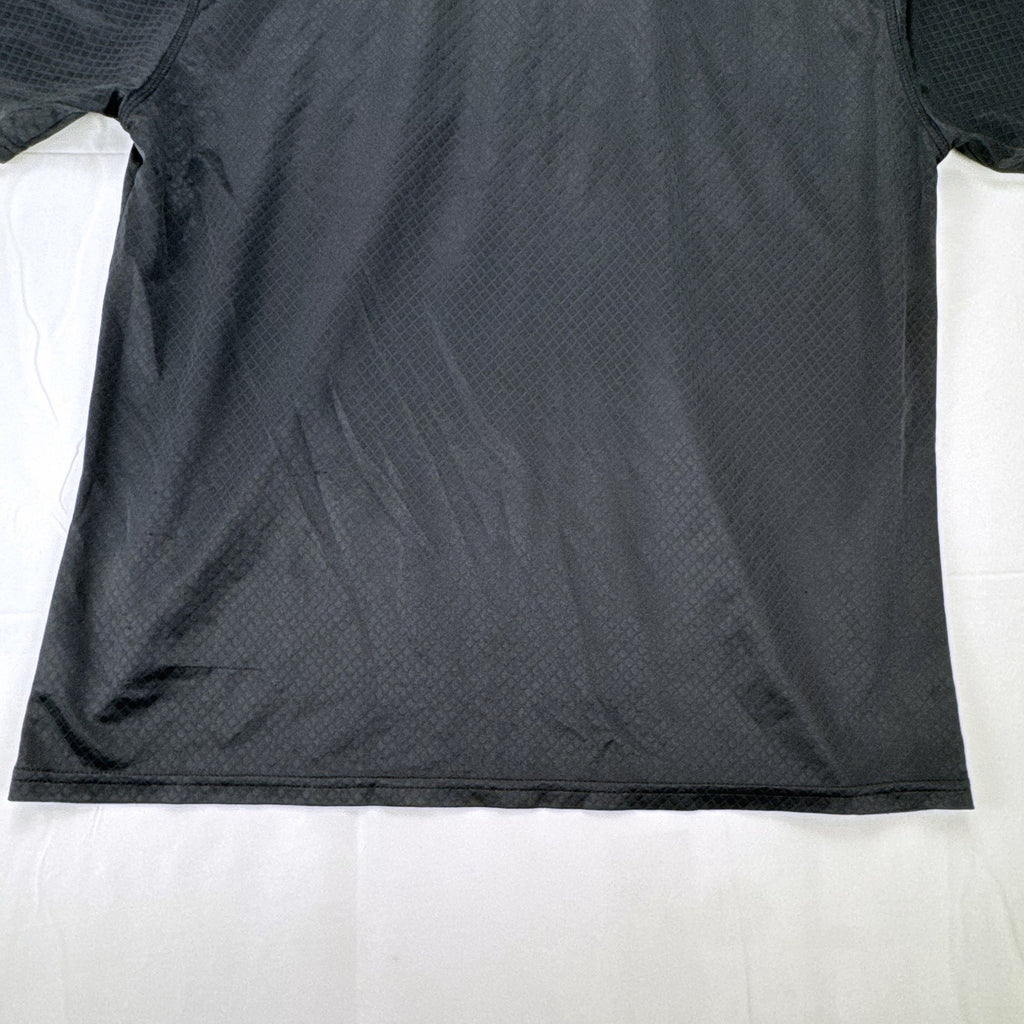 Front view of official Manchester United black short sleeve training jersey in men's size XL.