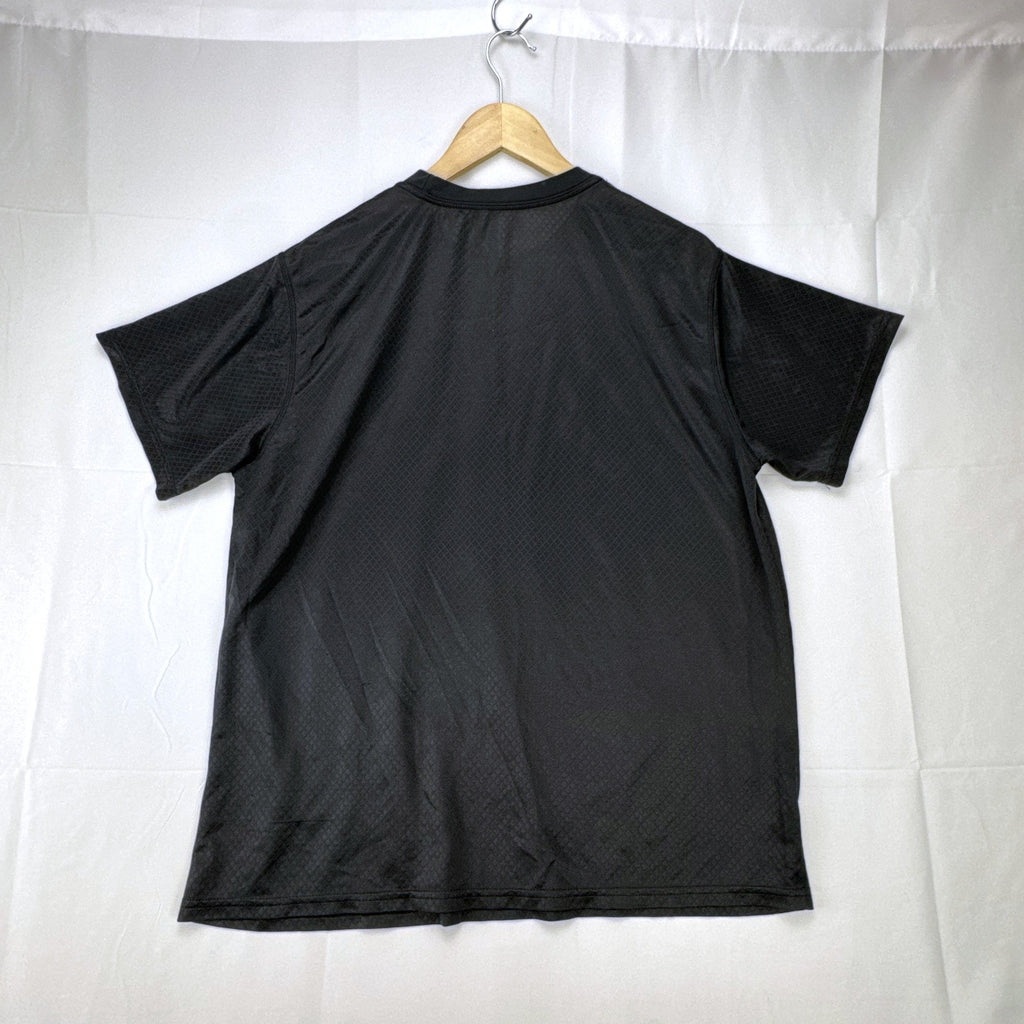 Front view of official Manchester United black short sleeve training jersey in men's size XL.