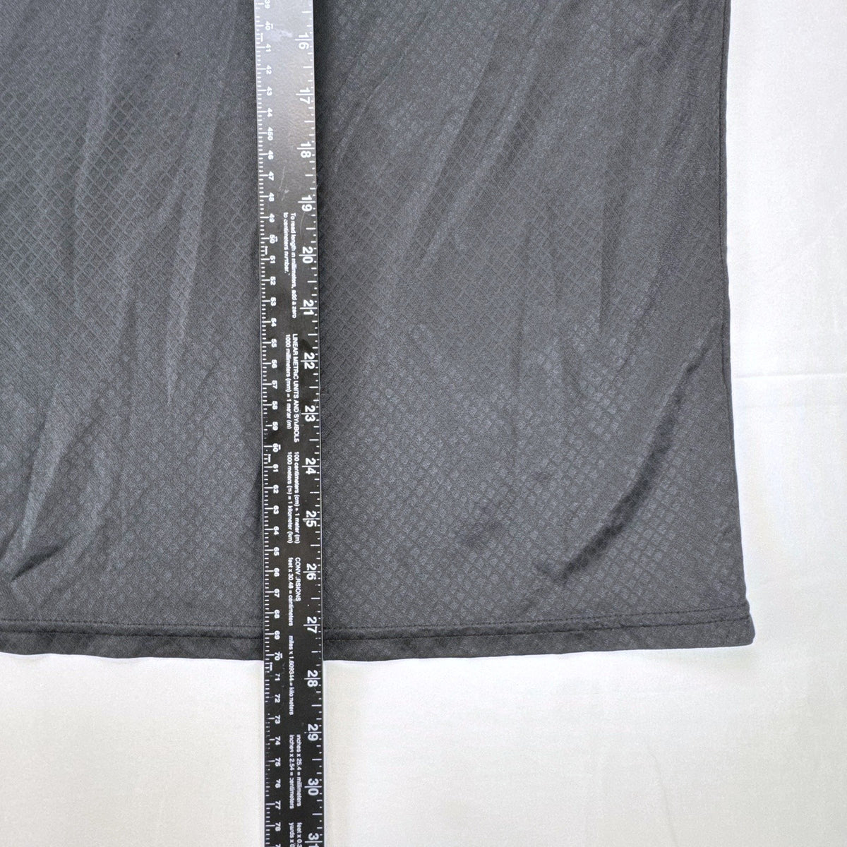Front view of official Manchester United black short sleeve training jersey in men's size XL.