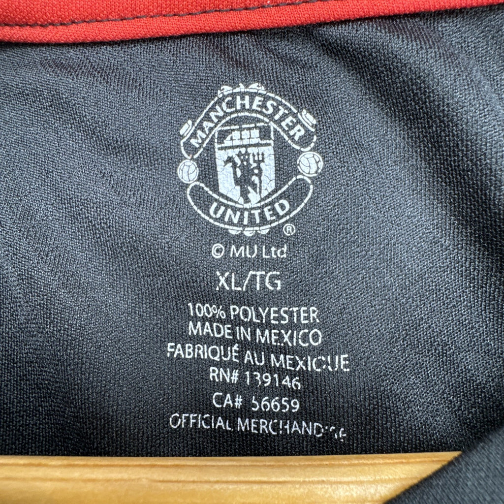 Front view of official Manchester United black short sleeve training jersey in men's size XL.