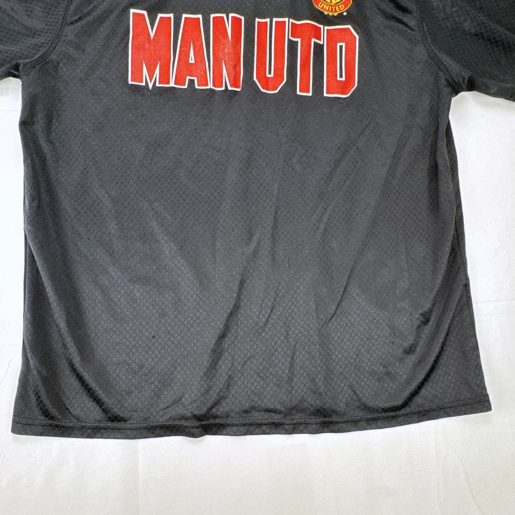 Front view of official Manchester United black short sleeve training jersey in men's size XL.