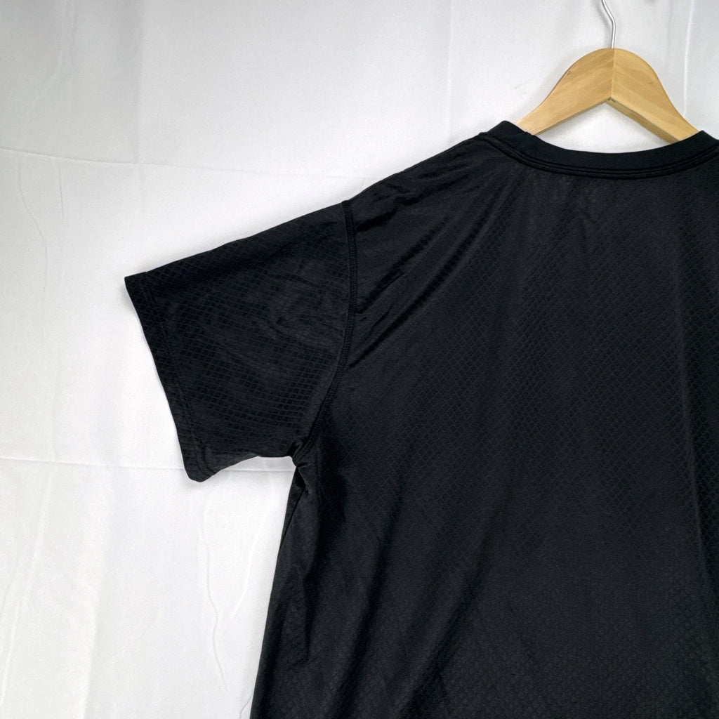 Front view of official Manchester United black short sleeve training jersey in men's size XL.