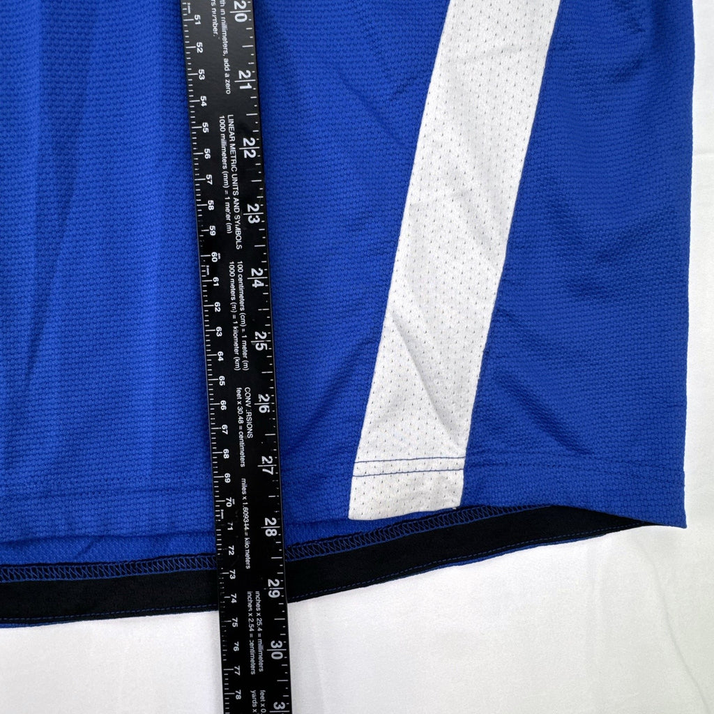 Manchester United men's large royal blue soccer jersey with embroidered chest crest and striped ribbed collar.