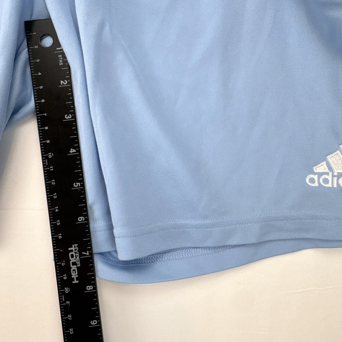 Adidas men's light blue Climalite soccer shorts with white 3-stripes in size Medium.