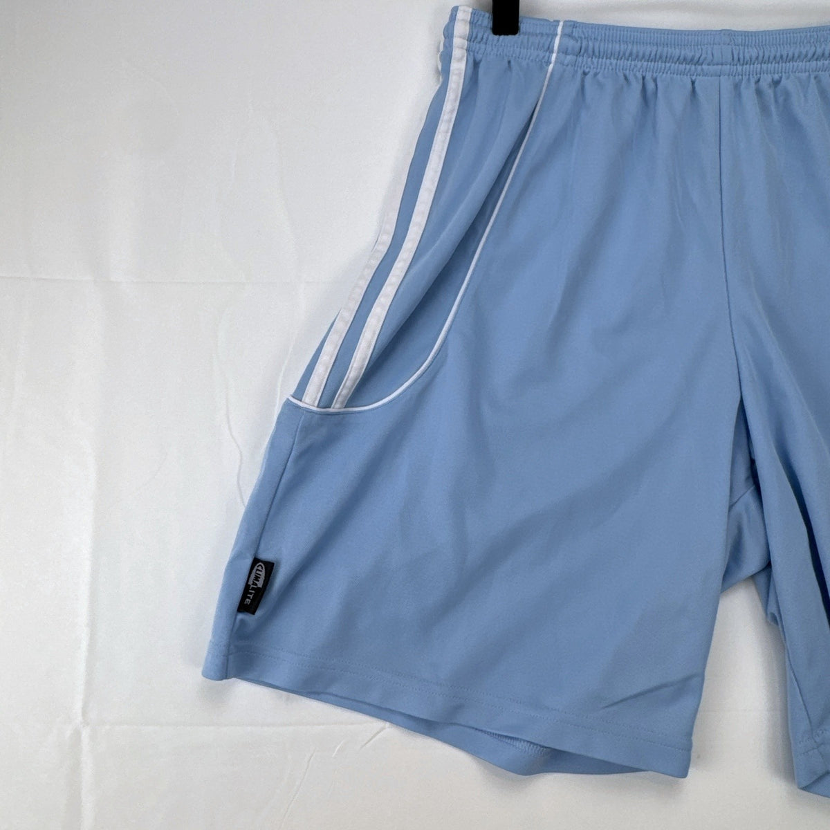 Adidas men's light blue Climalite soccer shorts with white 3-stripes in size Medium.