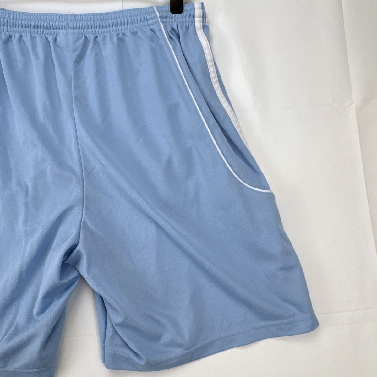 Adidas men's light blue Climalite soccer shorts with white 3-stripes in size Medium.