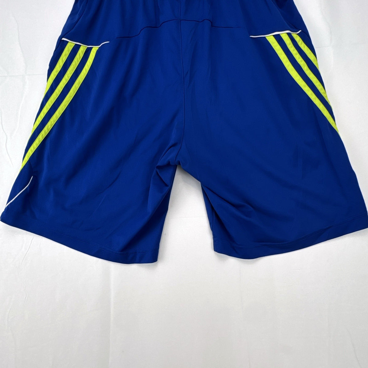 adidas men's royal blue athletic shorts with neon yellow three stripes, size medium