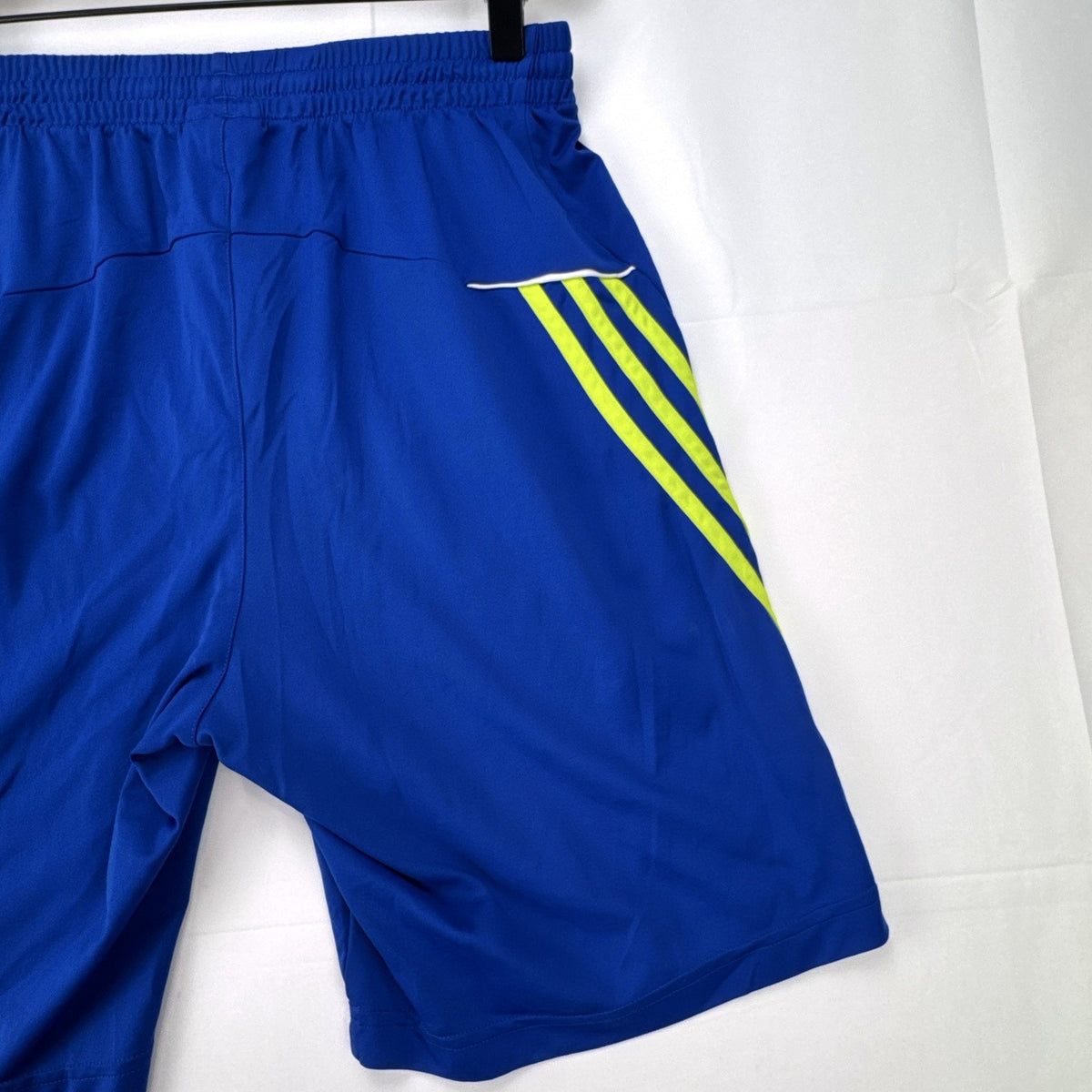 adidas men's royal blue athletic shorts with neon yellow three stripes, size medium