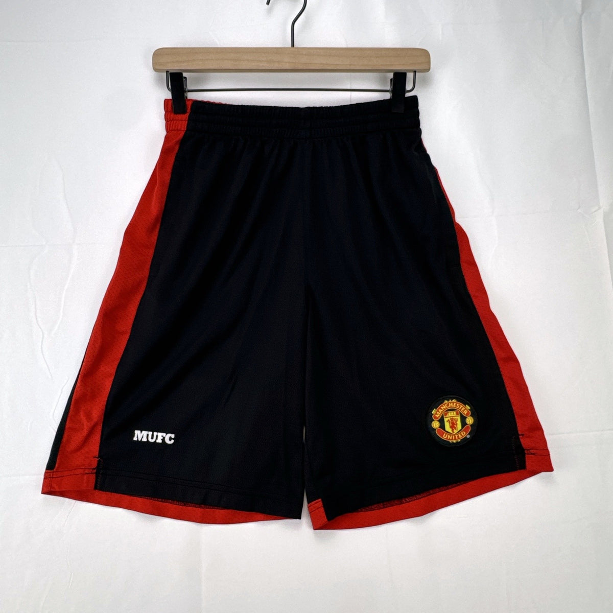 Manchester United men's black and red soccer shorts in size small with woven team crest and embroidered MUFC lettering