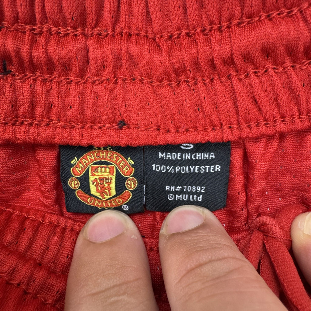 Manchester United men's black and red soccer shorts in size small with woven team crest and embroidered MUFC lettering