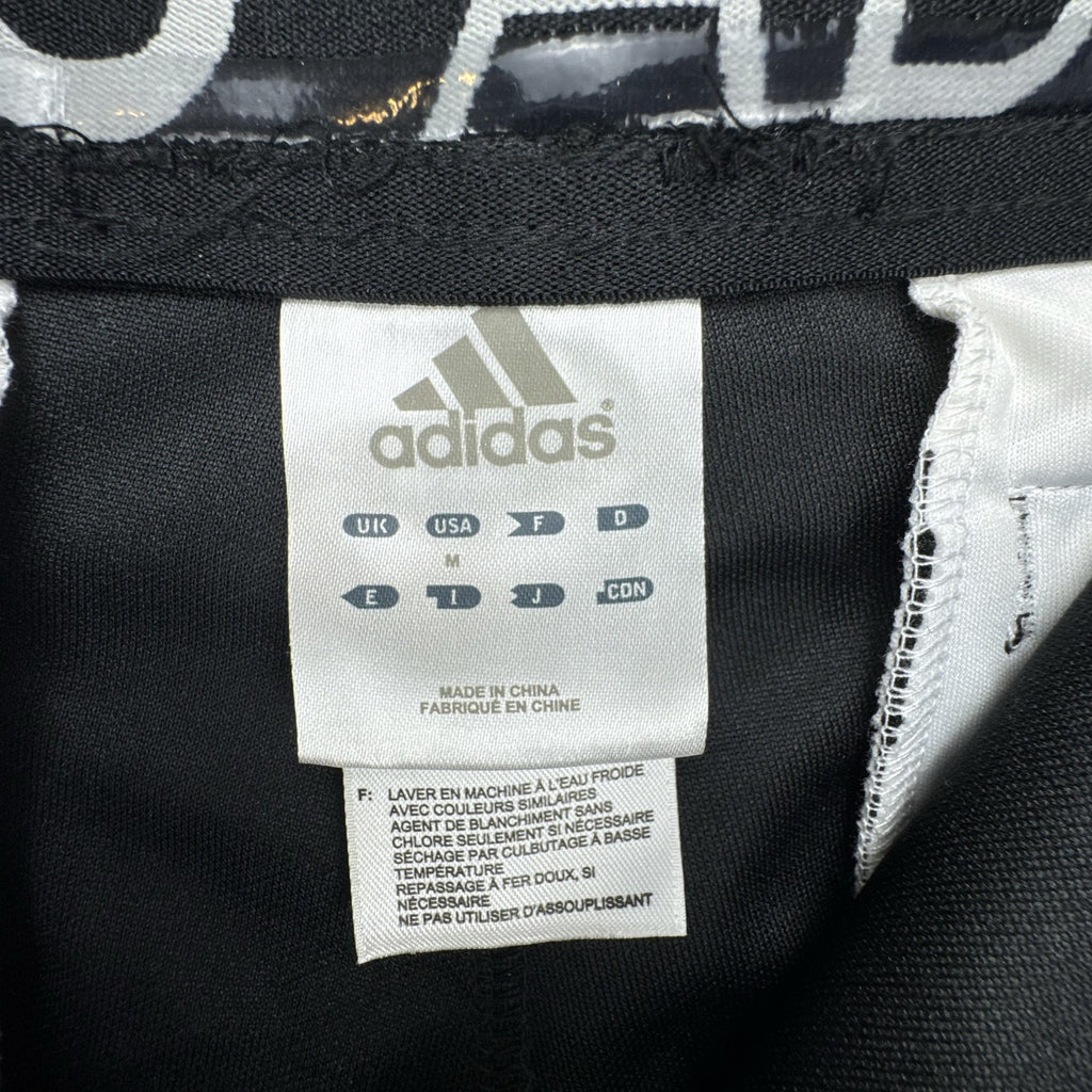 Black Adidas Climalite men's baseball pants with elastic cuffs in size medium