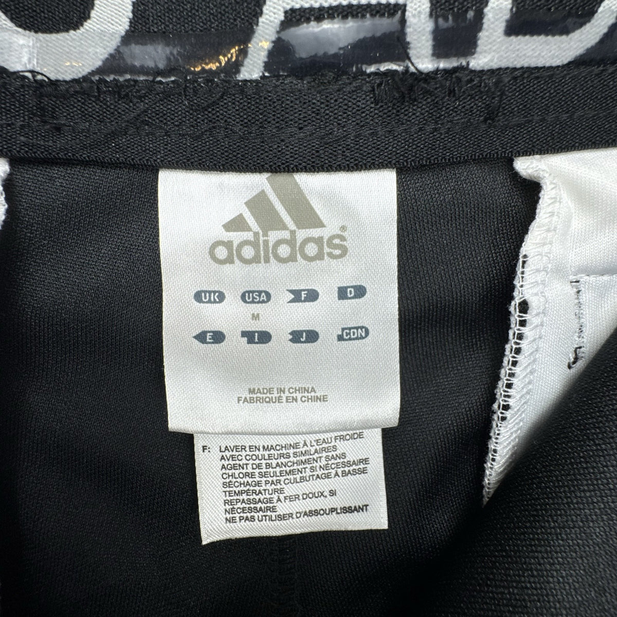 Black Adidas Climalite men's baseball pants with elastic cuffs in size medium