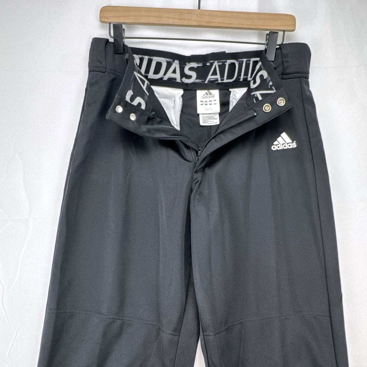 Black Adidas Climalite men's baseball pants with elastic cuffs in size medium