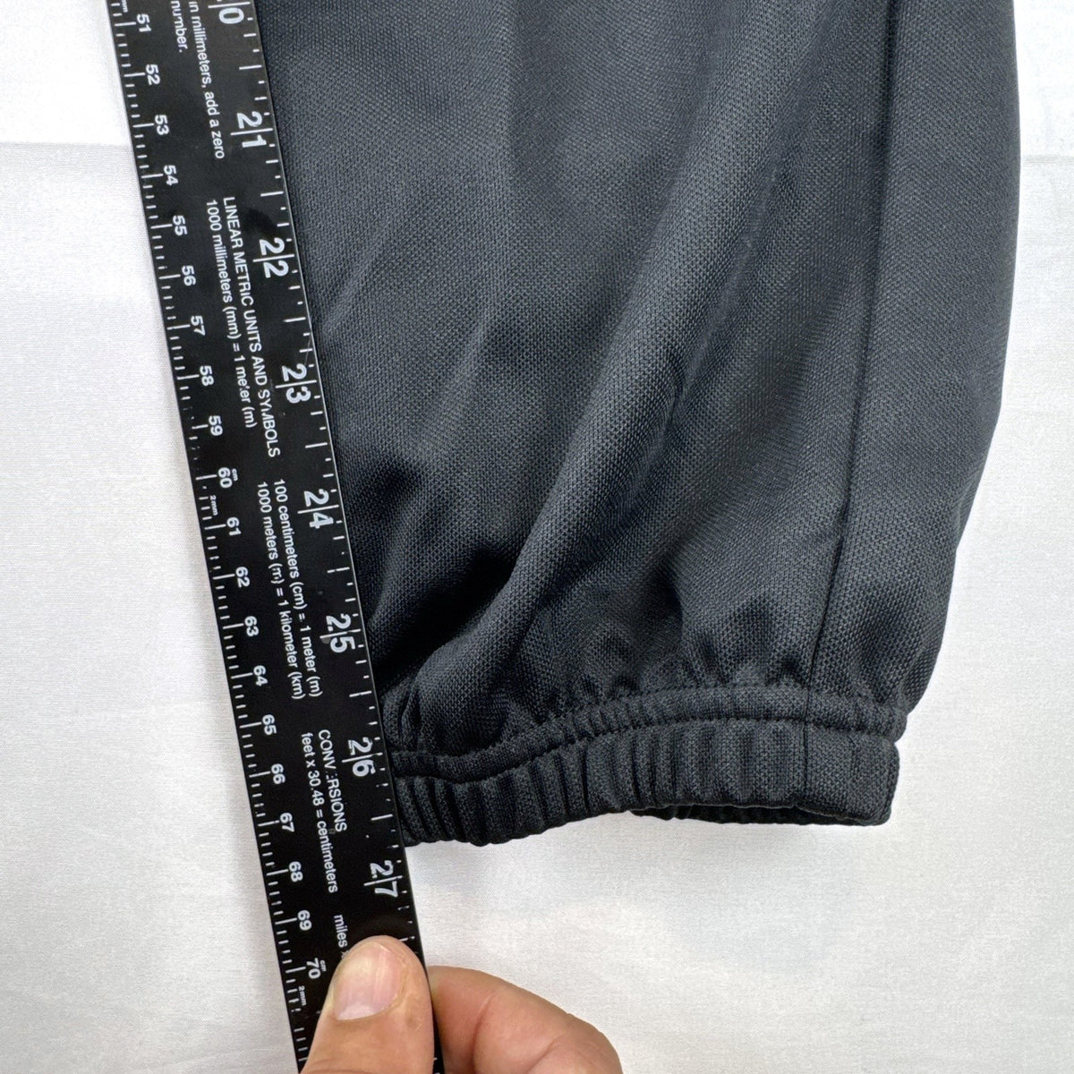 Black Adidas Climalite men's baseball pants with elastic cuffs in size medium