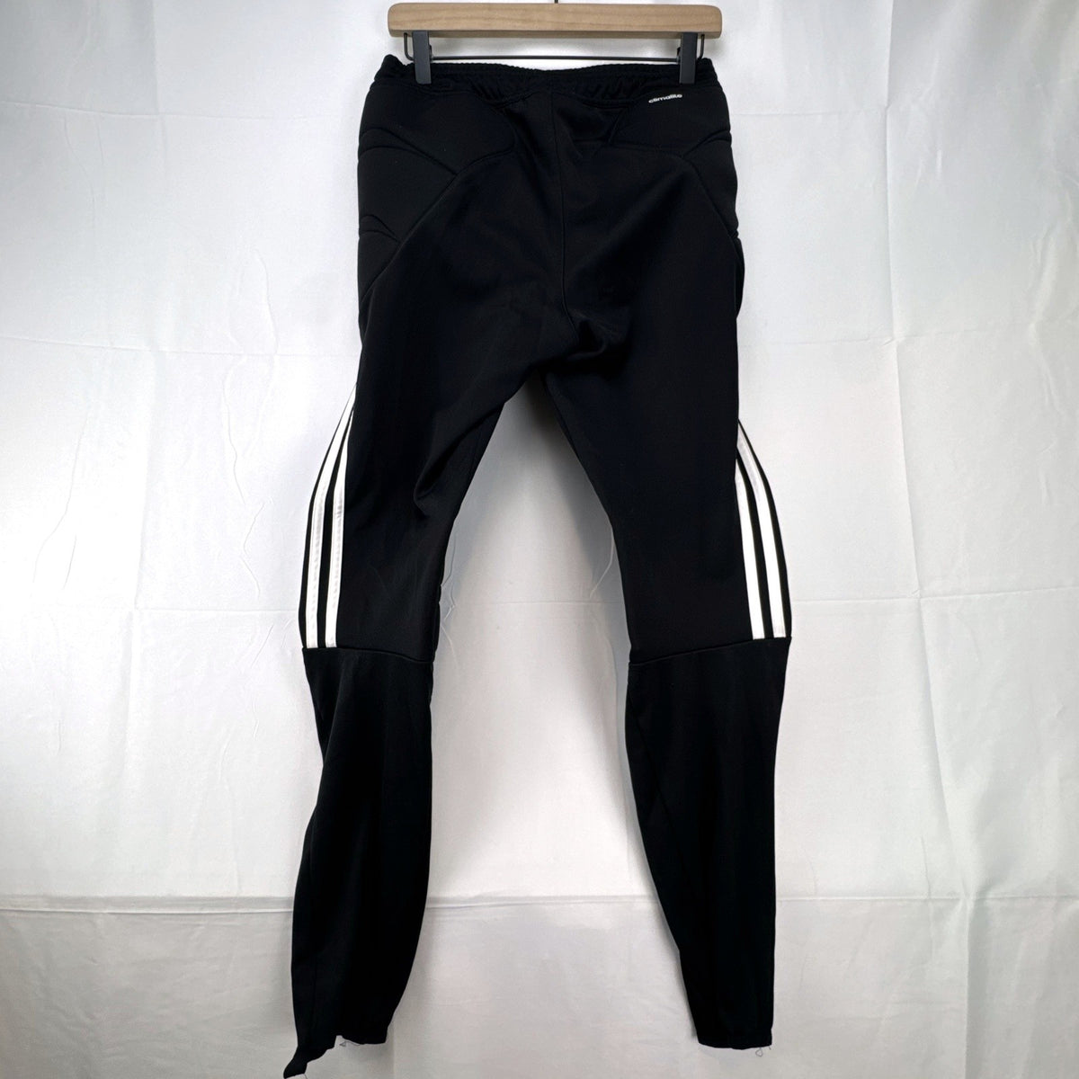 Black adidas Tierro padded goalkeeper soccer pants in men's size M with white 3-stripes