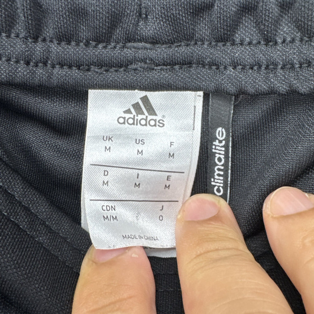 Black adidas Tierro padded goalkeeper soccer pants in men's size M with white 3-stripes