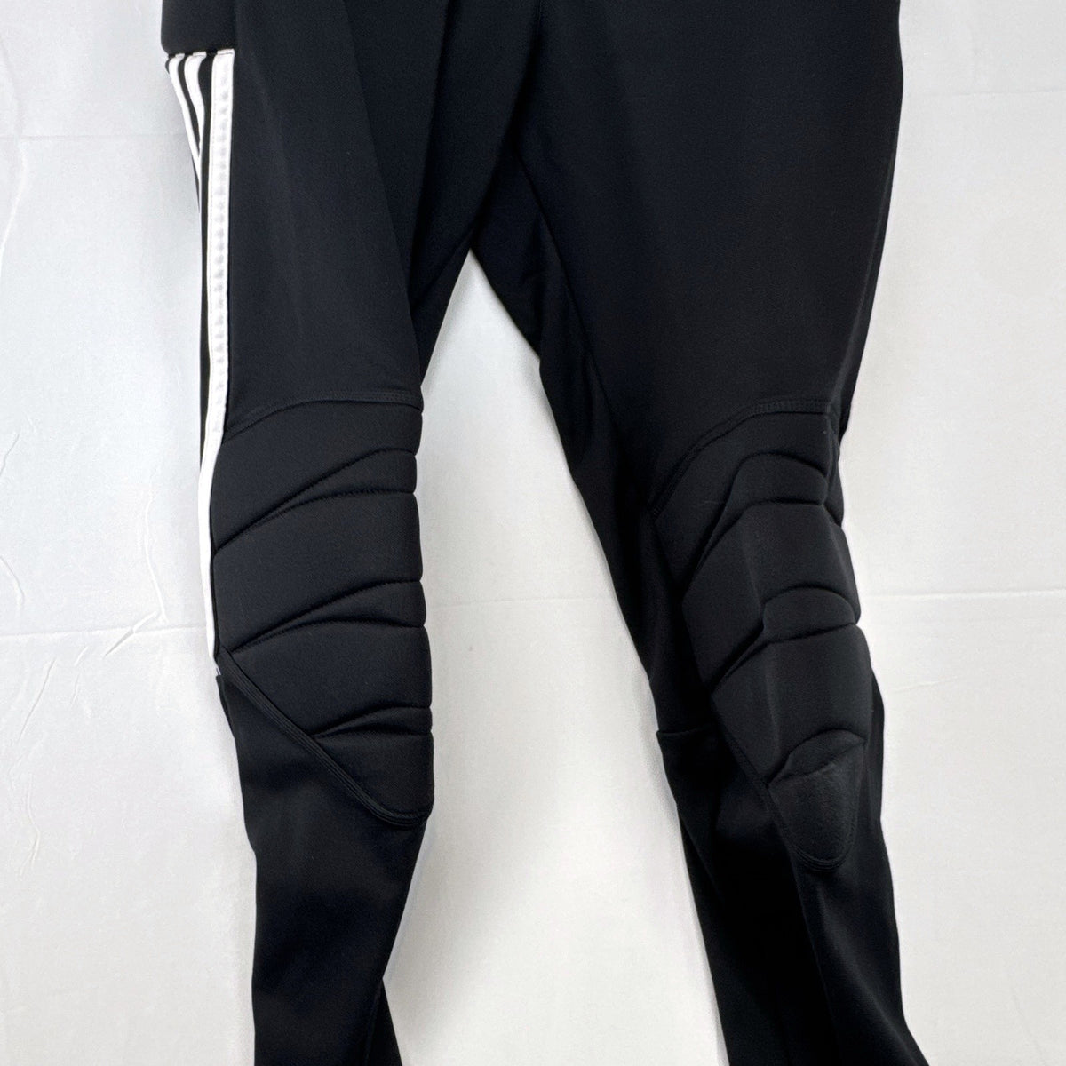 Black adidas Tierro padded goalkeeper soccer pants in men's size M with white 3-stripes