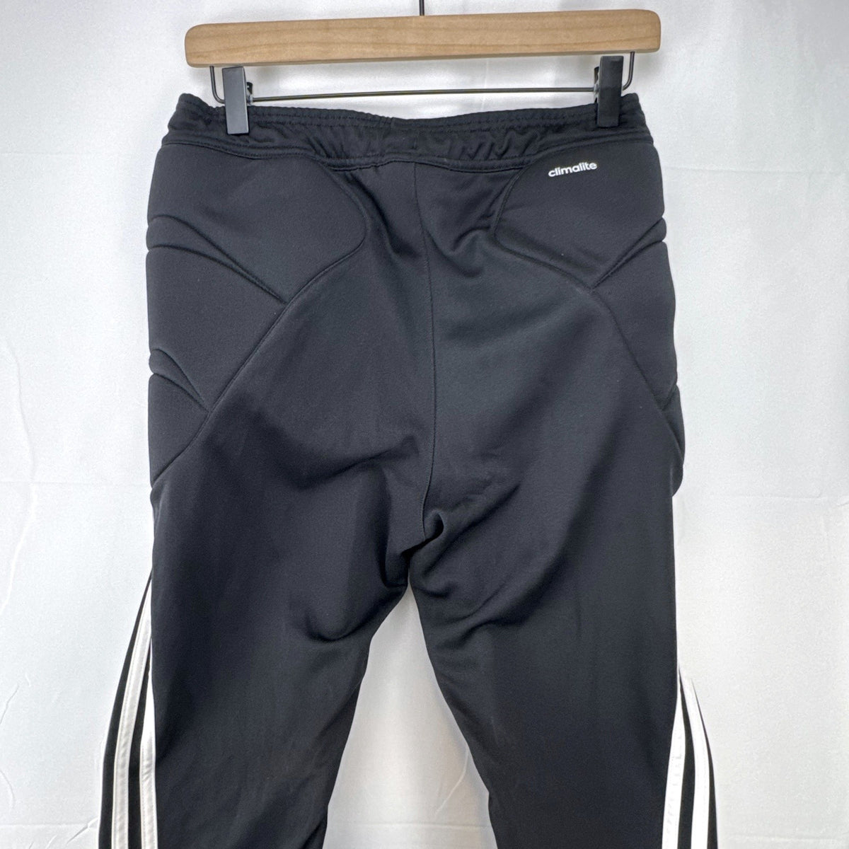 Black adidas Tierro padded goalkeeper soccer pants in men's size M with white 3-stripes