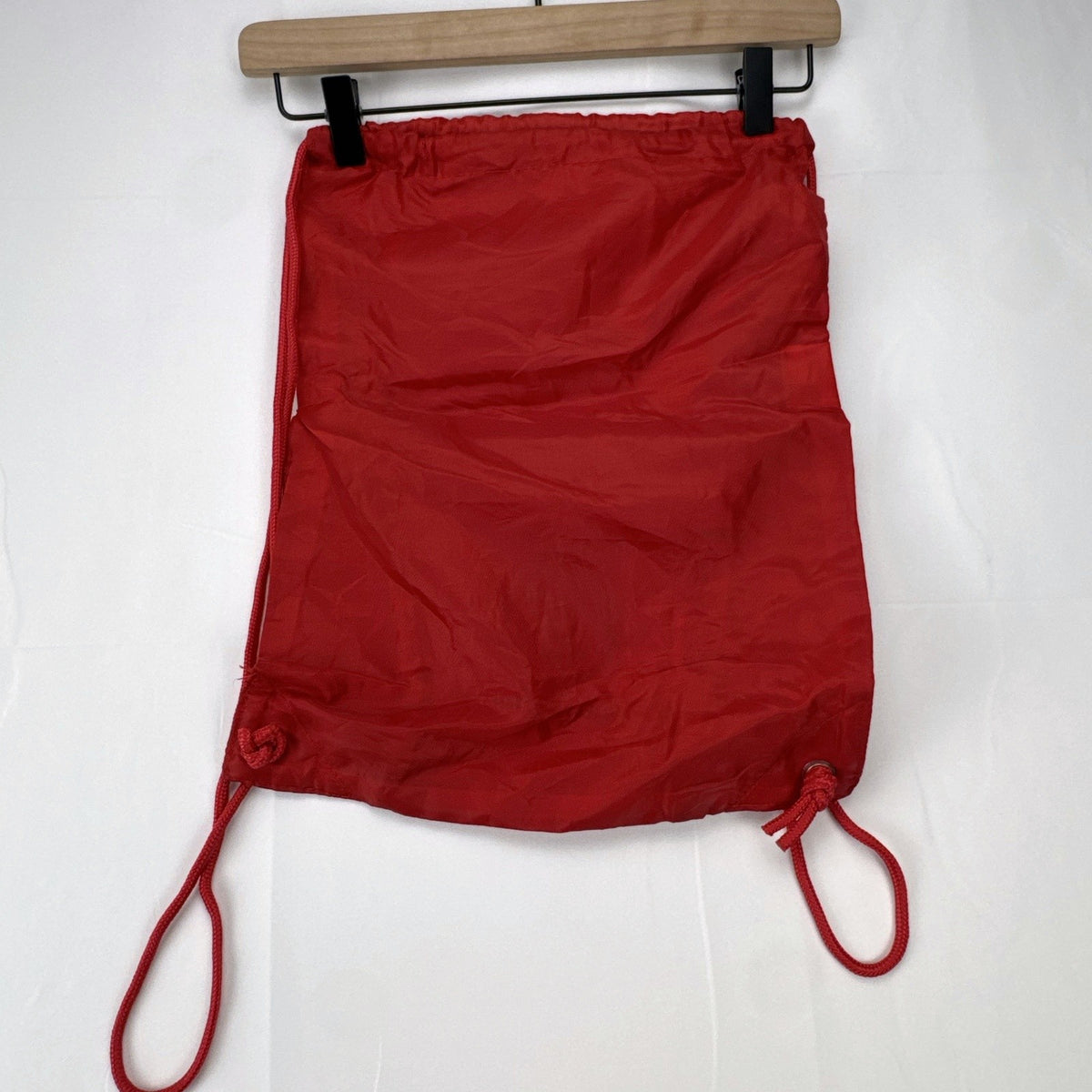 Manchester United FC red drawstring gym bag with embroidered crest and black trim
