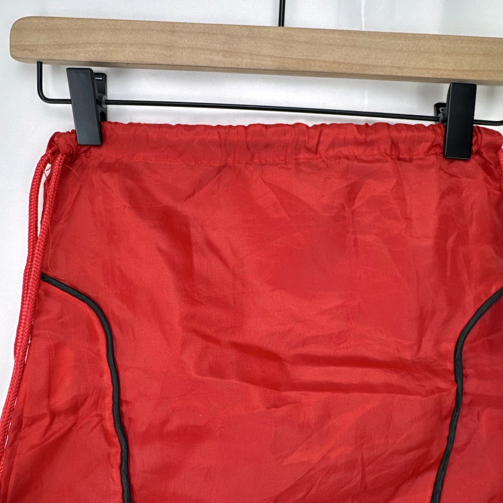 Manchester United FC red drawstring gym bag with embroidered crest and black trim