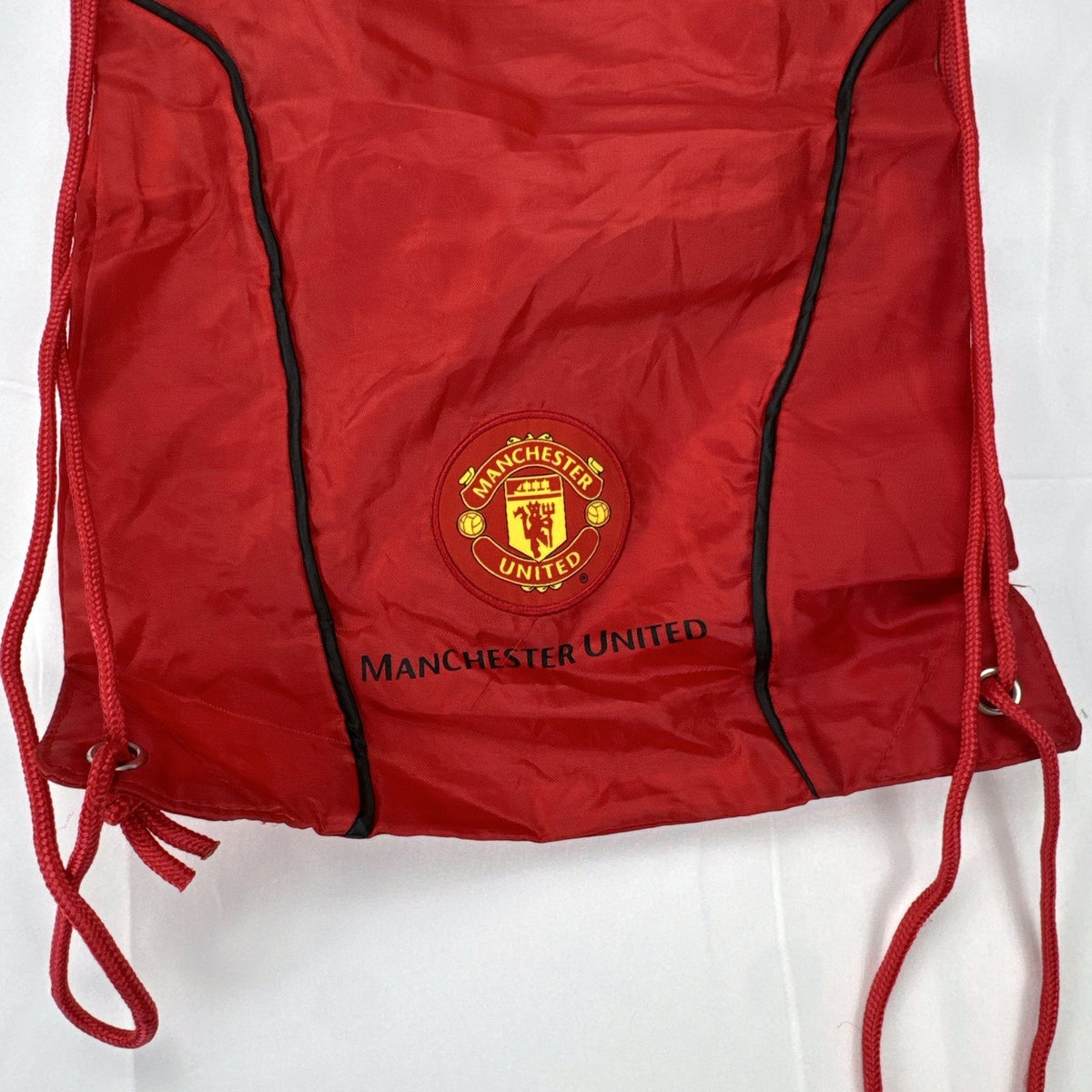 Manchester United FC red drawstring gym bag with embroidered crest and black trim